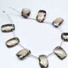 Smoky Quartz Faceted Cushion Shape Beads Strand 1 Matching Pair and Size 16mm x 10mm approx. Hydro quartz is synthetic man made quartz. It is created in different different colors and shapes. 